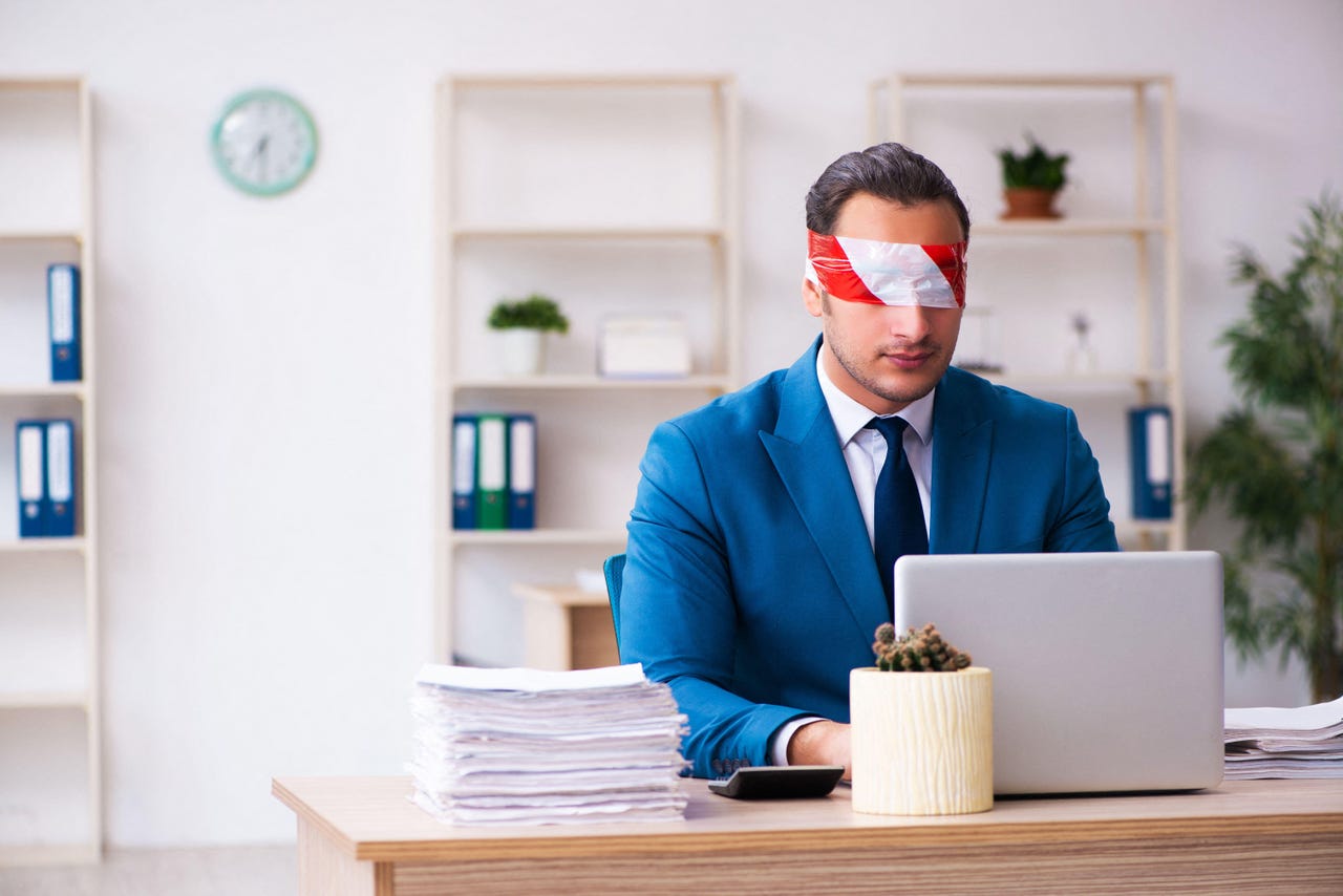 office worker blindfold Elnur Amikishiyev Alamy